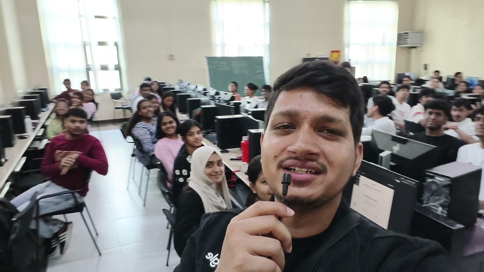 Ali Mustufa Shaikh with generative AI workshop participants seated at computers at Somaiya Vidyavihar University in Vidyavihar East, Mumbai.