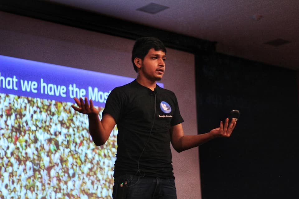 Ali Mustufa Shaikh delivering the IEEE Day keynote at Pillai College, gesturing in front of a projected slide.